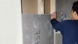 laying tile Fasten the backer board with nails or screws.