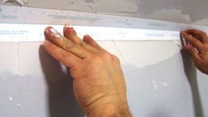  Fold the tape along the crease to fit the angled joint.
