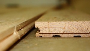 Hardwood flooring planks usually feature tongue-and-groove construction