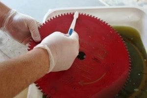 Using an old toothbrush scrub the pitch and resins away