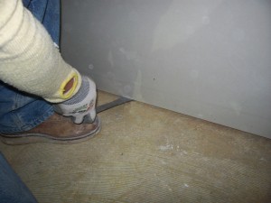 How to build a wall 6 Use a small pry bar to lift the bottom of the sheet off the floor