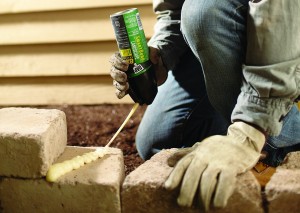 Use landscape adhesive to repair loose or wobbly stones