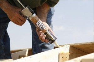 Add strength to a shed roof by applying a bead of strong construction adhesive