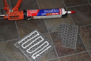 Use construction adhesives for resetting a new tile