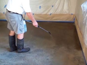 Use a plastic garden sprayer to apply the stain. 