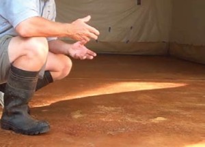 After the stain is dry, a powder residue covers the floor.