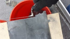 Line up the score mark with the edge of a piece of plywood