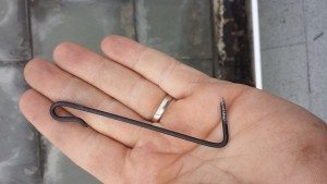 The alternative method of attaching new slate is with a slate hook.